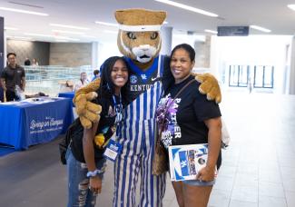 UK Wildcat at orientation with student and guest