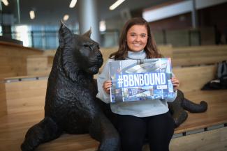 Student with admit packet bbn bound in student center