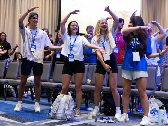 Photo of students spelling CATS cheer at summer BBNO